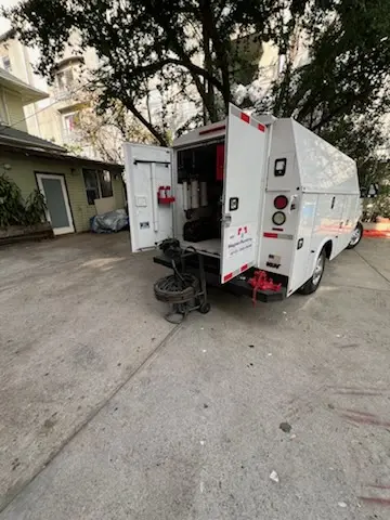Magnet Plumbing service vehicle on-site for Grease Trap Cleaning in Plandome Manor